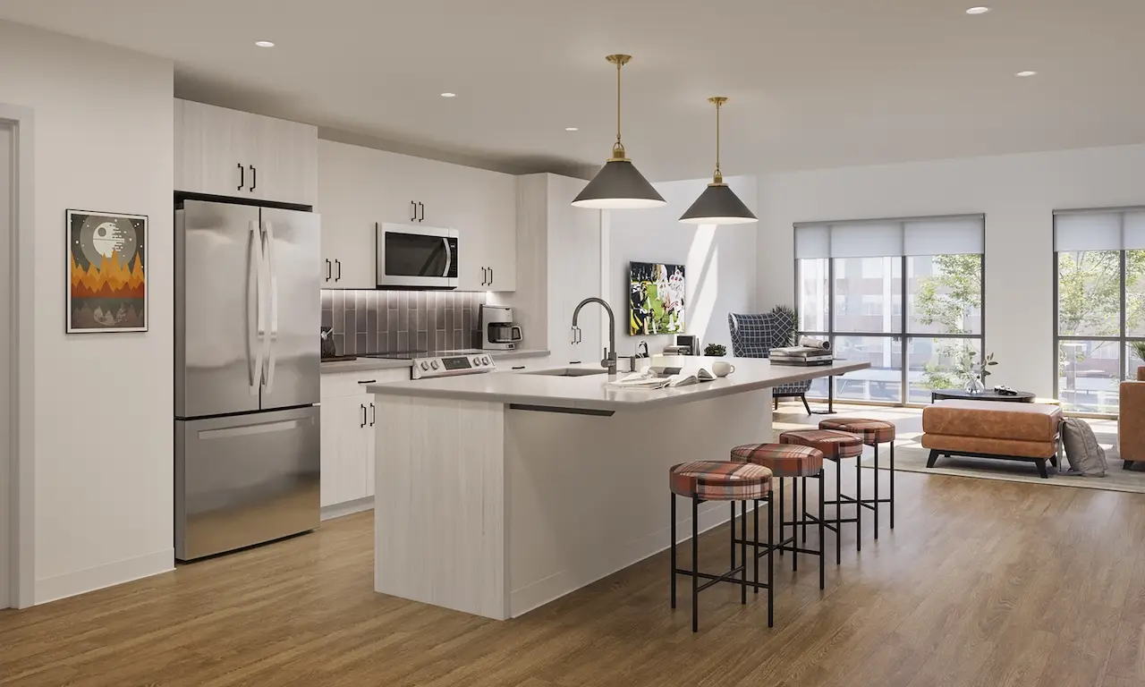 Modern kitchen with stainless steel appliances at Theory Madison Apartments.